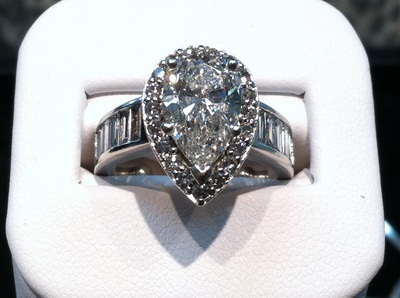 Custom White Gold and Pear Shaped Diamond Ring with halo and baguettes