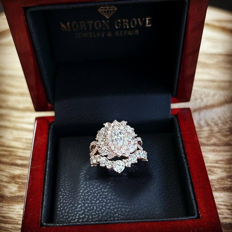 Custom designed rose gold and diamond engagement ring and wedding band